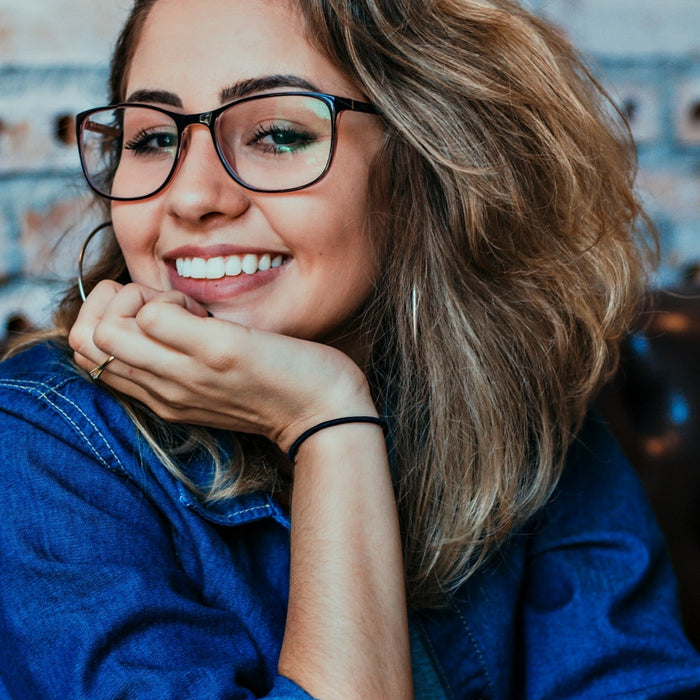 closeup photo of woman wearing black framed eyeglasses