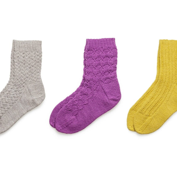 blue and black socks on white background