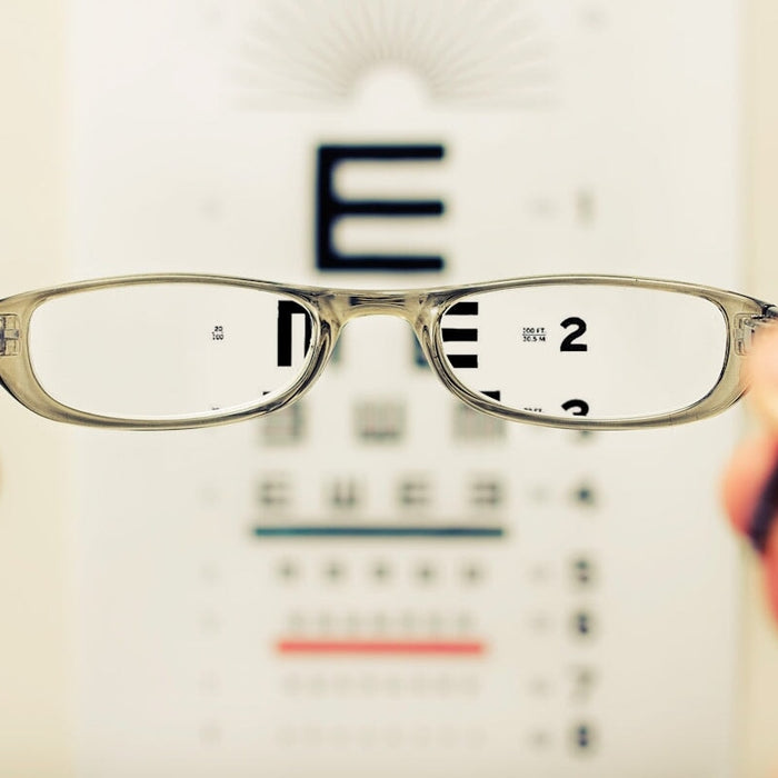 person holding eyeglasses